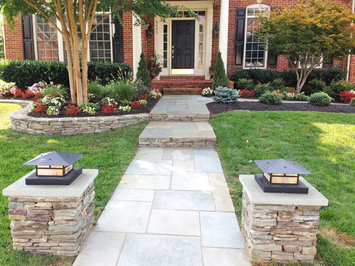 Walkway of a luxury house with very well maintained landscape